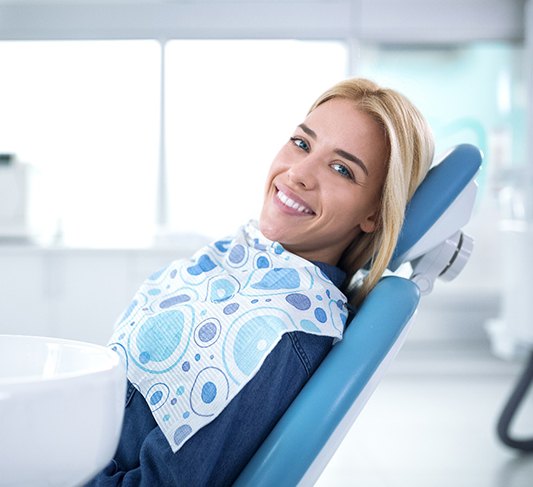 Female dental patient after receiving dental implants in North Raleigh, NC