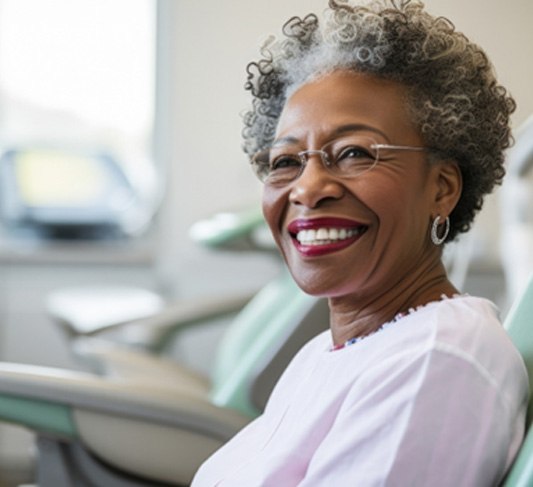 smiling older woman in the dental chair for intro section