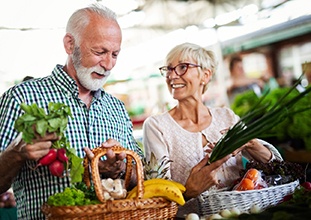 a mature couple shopping for nutritious food in Raleigh