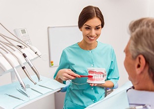a patient visiting their dentist for dentures