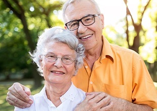 happy elderly couple in nature 