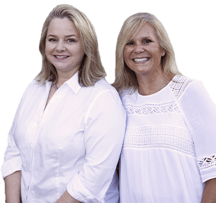 Two smiling dental team members in Raleigh