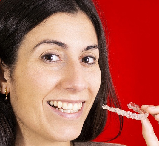 Woman smiling with Invisalign in Raleigh