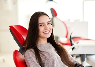 woman smiling during cosmetic consultation