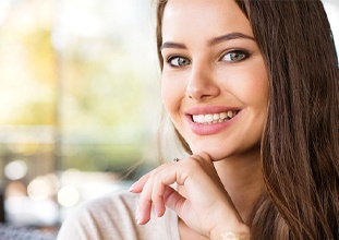 woman smiling after getting veneers in North Raleigh