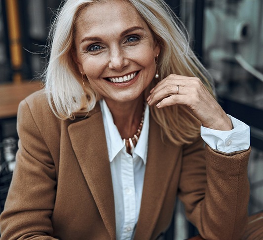 Woman smiling with veneers in North Raleigh