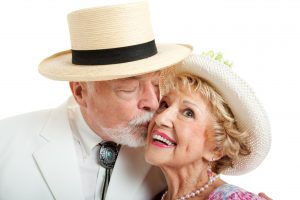 older man kissing older woman