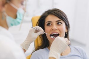 A woman getting her fillings placed.