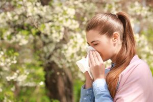 a woman blowing her nose