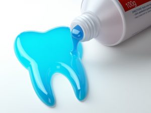 toothpaste spilling out in the shape of a tooth