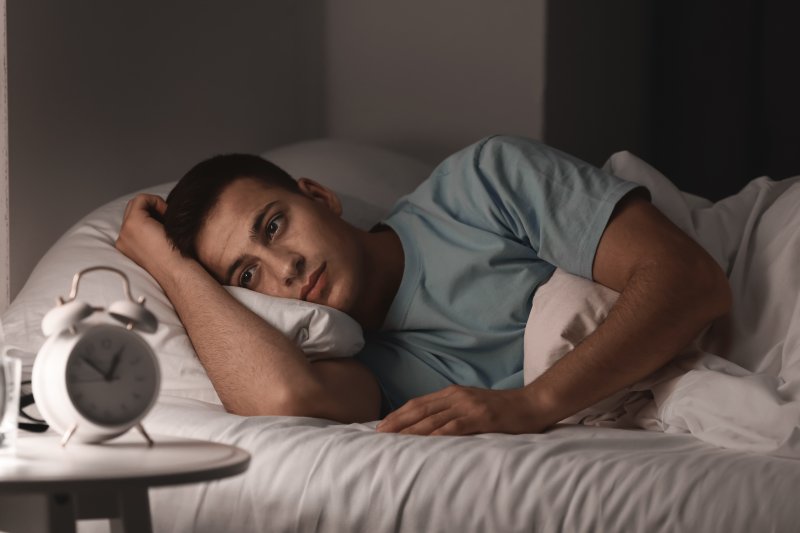 man having trouble sleeping