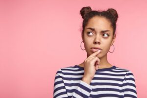 Woman wondering about cosmetic dentistry